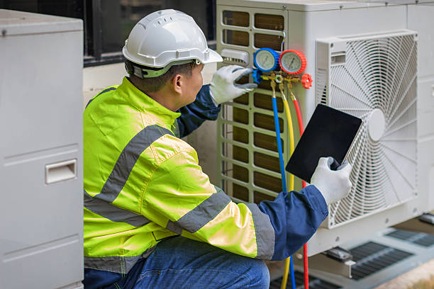 Professional Air Duct Cleaning technician working in West Chicago, IL
